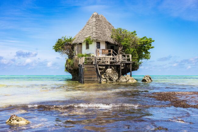 A beautiful tropical beach with white sand and clear blue water on the island of Zanzibar