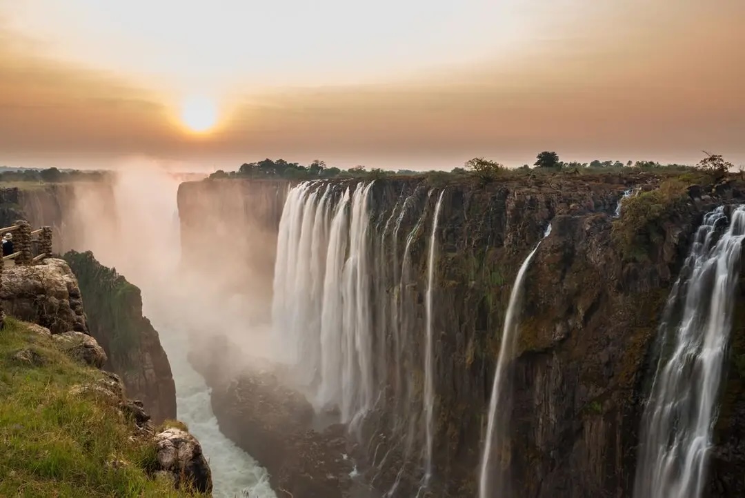 View of Victoria Falls during dry season at sunset.