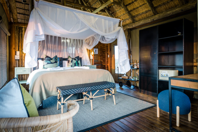 Beautiful bedroom interior of tree camp chalet in Kruger